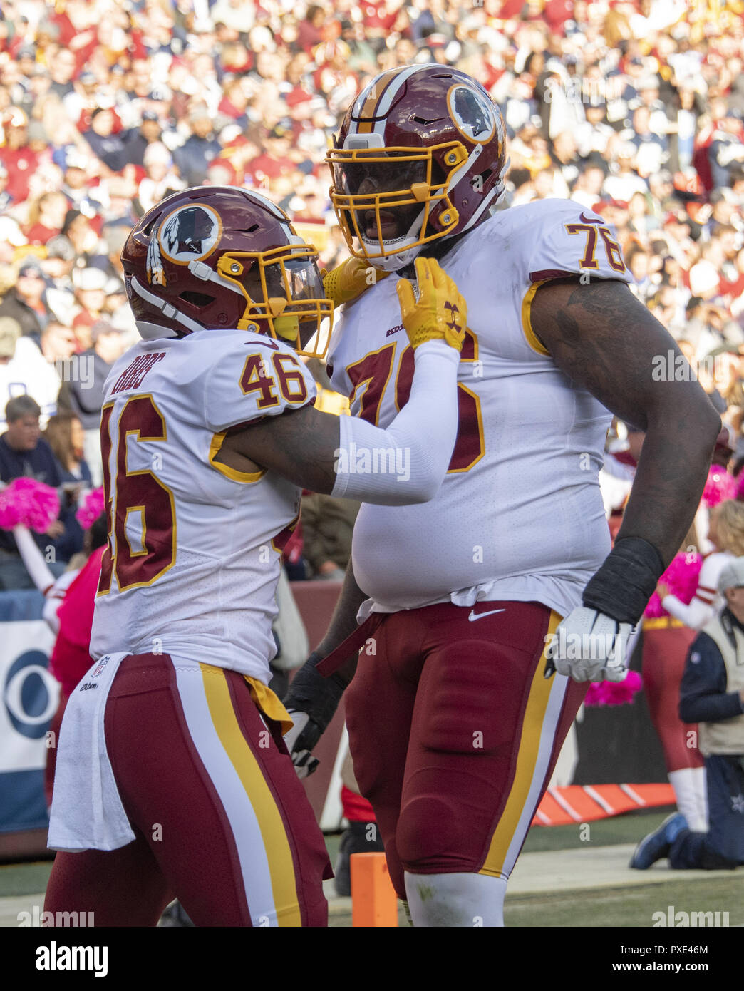 Landover, Maryland, USA. 21st Oct, 2018. Washington Redskins running back Kapri Bibbs (46) and offensive tackle Morgan Moses (76) celebrate Bibbs' first quarter touchdown against the Washington Redskins at FedEx Field in Landover, Maryland on Sunday, October 21, 2018 Credit: Ron Sachs/CNP/ZUMA Wire/Alamy Live News Stock Photo