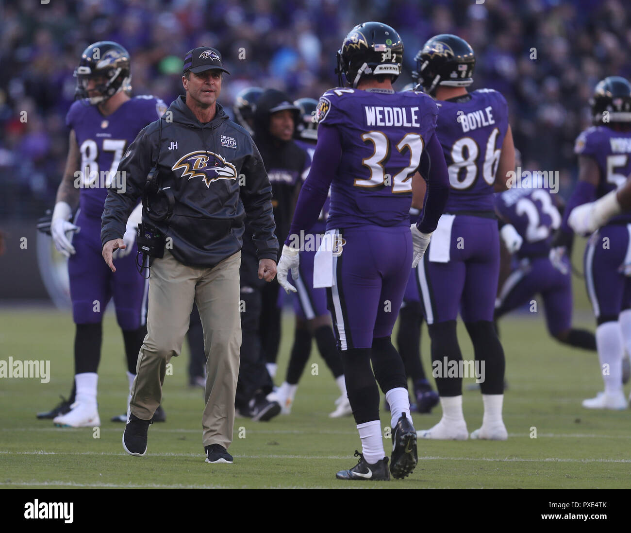 Baltimore, USA. 21st Oct 2018. Baltimore Ravens head coach John Harbaugh  congratulates players after a fumble recovery during a game against the New  Orleans Saints at M&T Bank Stadium in Baltimore, MD