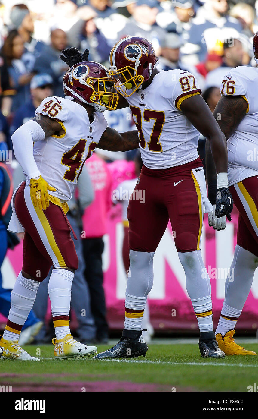 Landover, MD, USA. 21st Oct, 2018. Washington Redskins RB #46 Kapri Bibbs  celebrates a touchdown with Washington Redskins TE #87 Jeremy Sprinkle  during a NFL football game between the Washington Redskins and