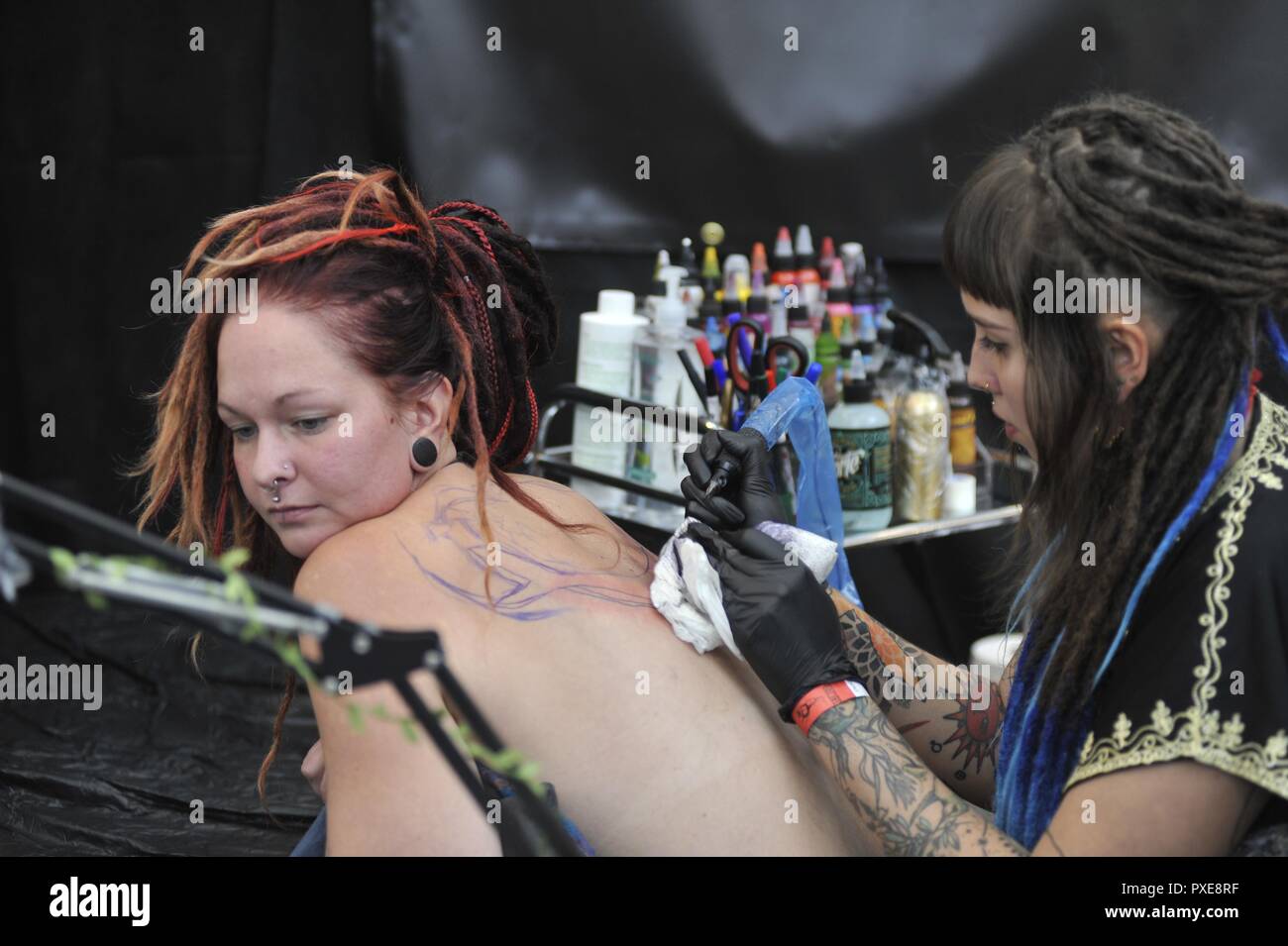Brno, Czech Republic. 20th Oct, 2018. The second year of the Tattoo Grand Prix festival starts in Brno, Czech Republic, on October 20, 2018. The interest of visitors is great, dozens of people leave the event with a new tattoo. Credit: Igor Zehl/CTK Photo/Alamy Live News Stock Photo