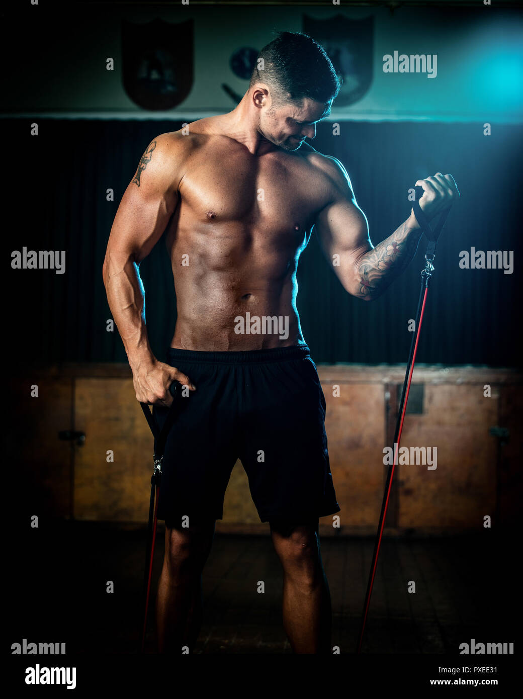 Male using resistance bands during training exercise Stock Photo