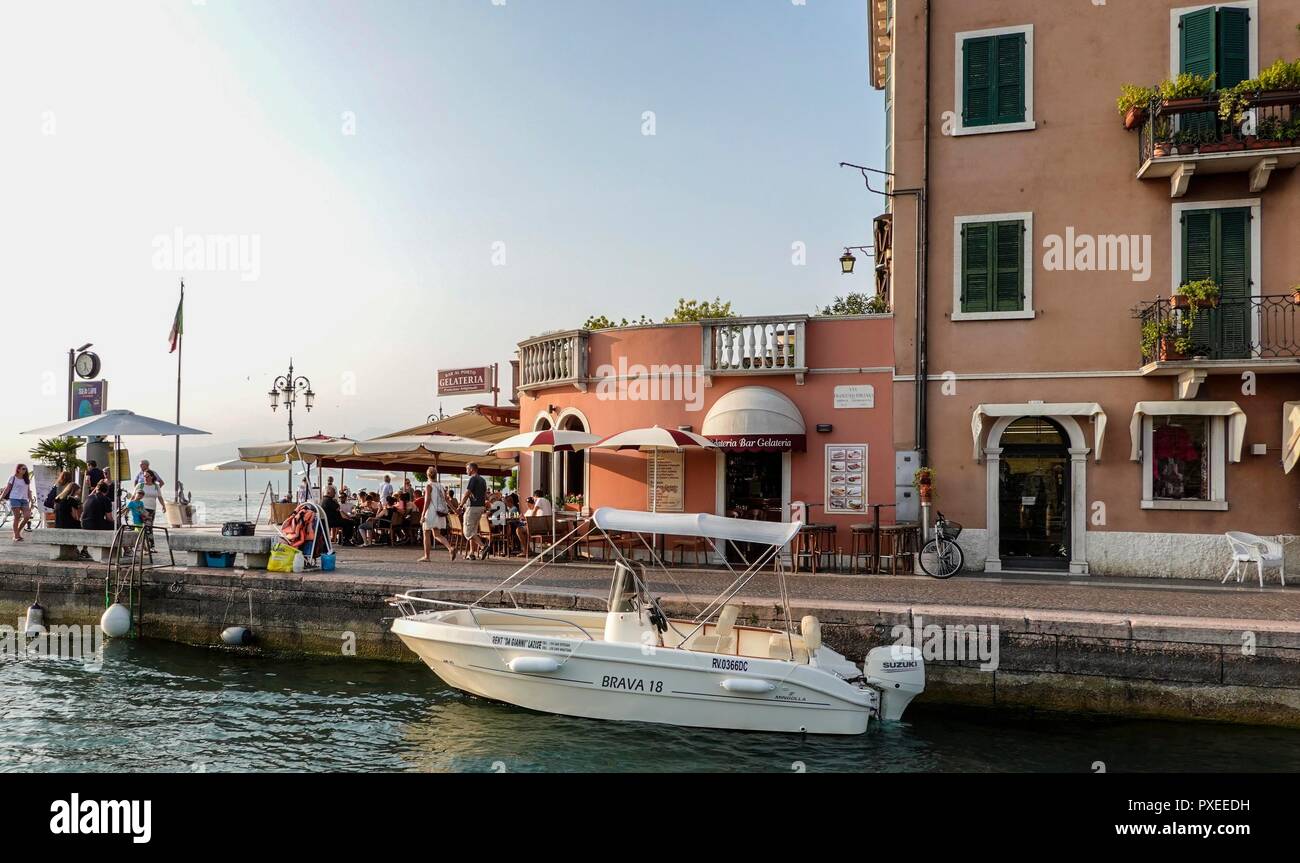 Italy, Garda Lake, Lazise. The waterfront of Lazise is a perfect place to spend an evening Stock Photo