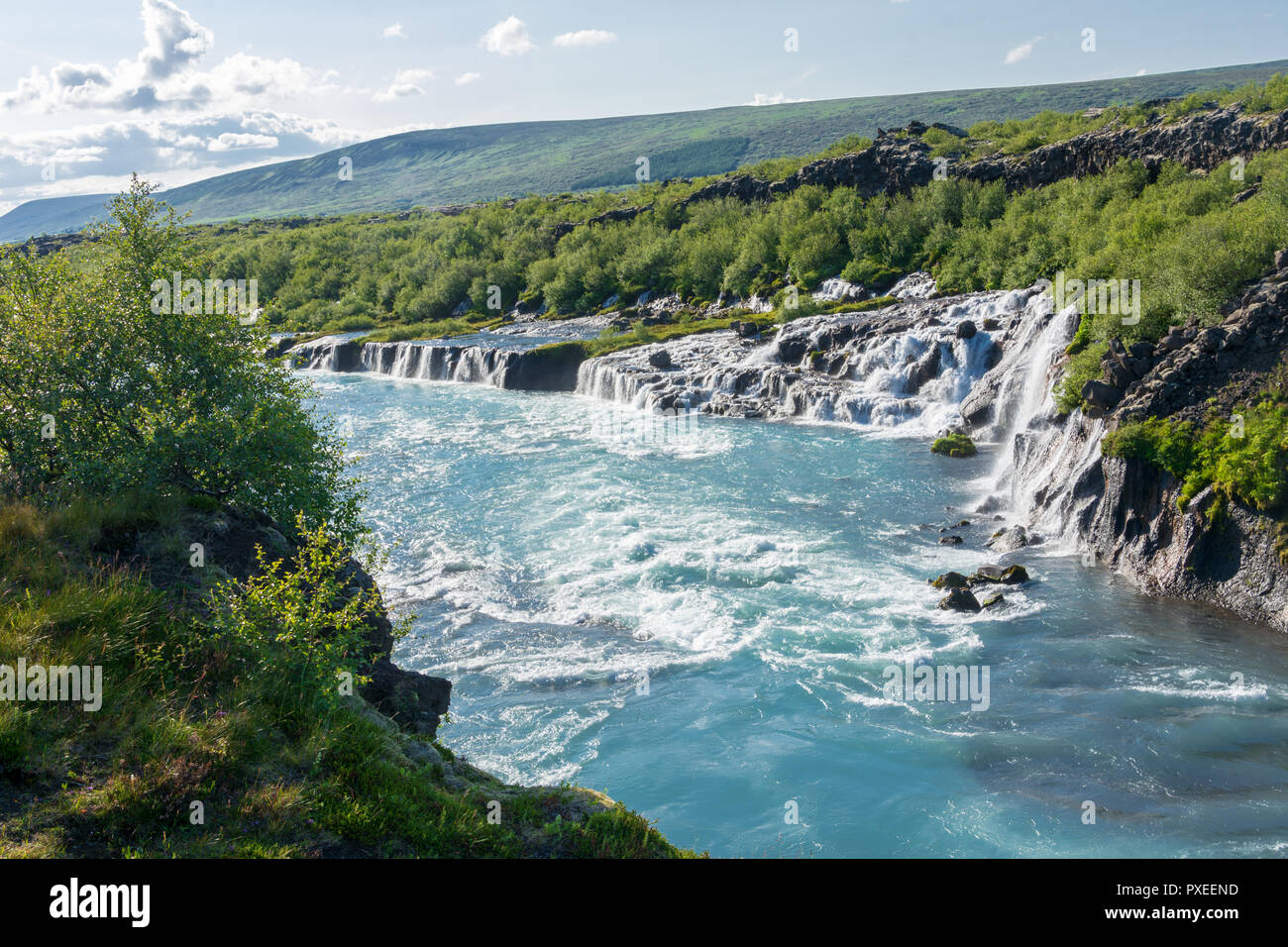 Hraunfossar lava falls in Iceland, where water comes out of the porous lava rock as watterfalls Stock Photo