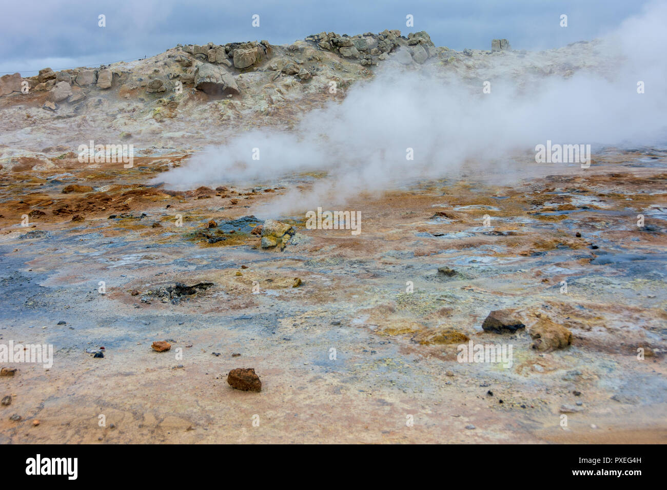 Namafjall Hverir geothermal area in North Iceland near Lake Myvatn.  This area is rich in sulfur volcanic mud pools and steam with colorful formaions  Stock Photo