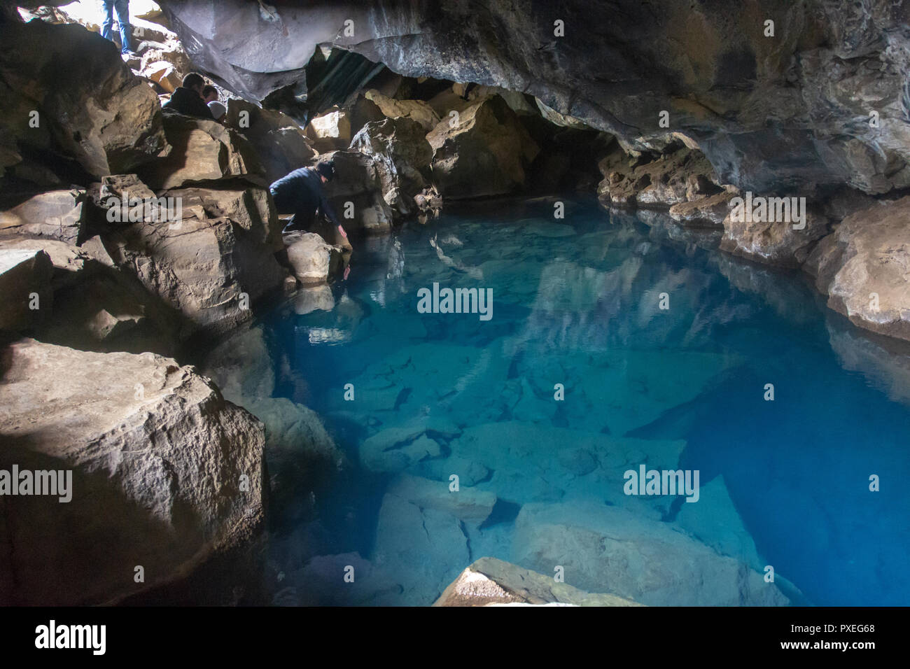 Grjotagja cave in the Kfala area near Lake Myvatn, Iceland.  For years this had been a natural warm water bathing place. Stock Photo