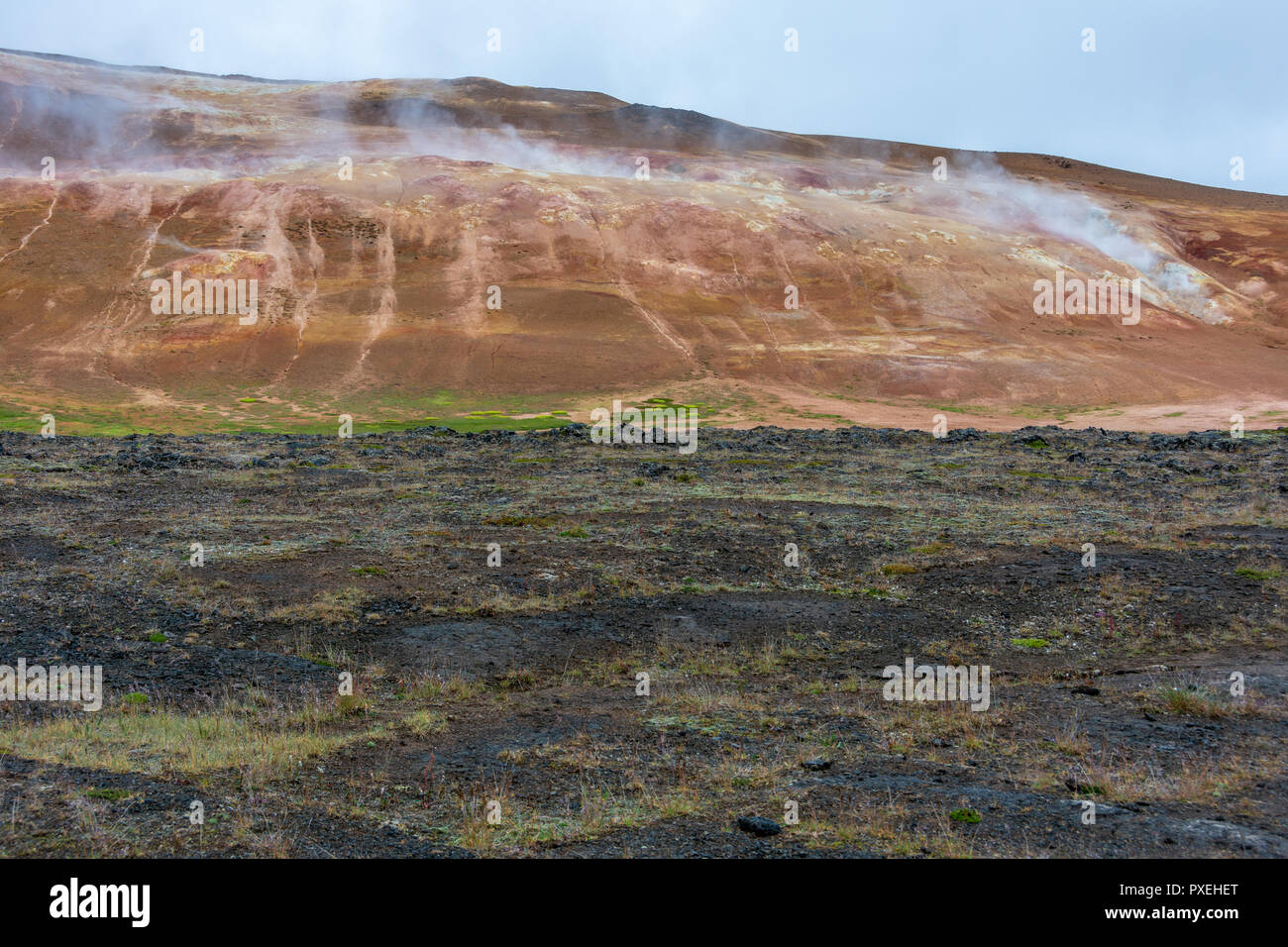 Leirhnjukur - Clay Hill - In North Iceland - a beautiful volcanic lava fields with lava rivers and rhyolite formations featuring pahoehoe lava, lava f Stock Photo