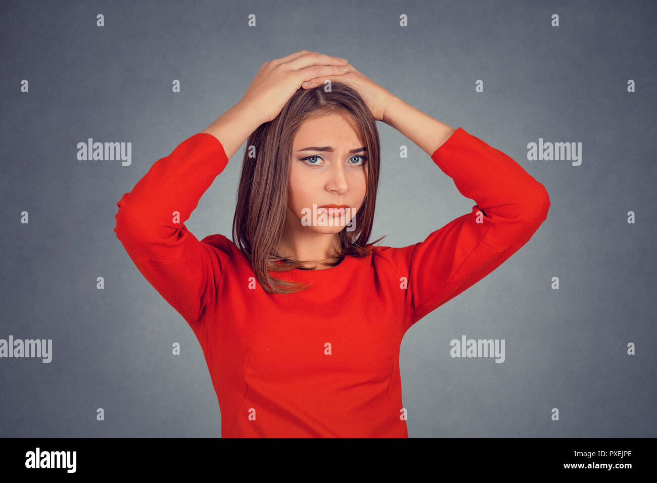stressed out young woman with worried face expression looking Stock