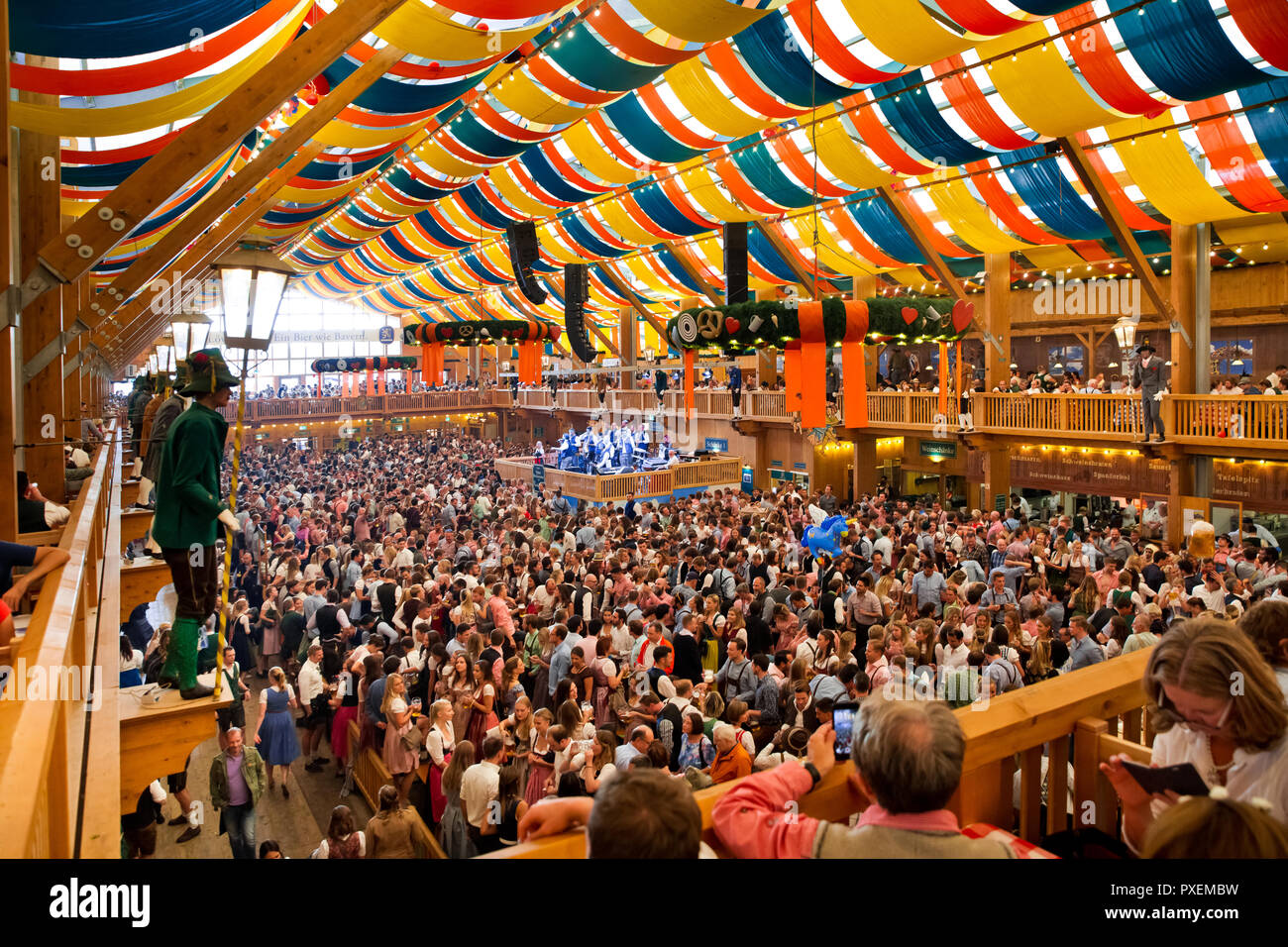 Crowd of people in Lowenbrau tent in Munich city, Germany Stock Photo