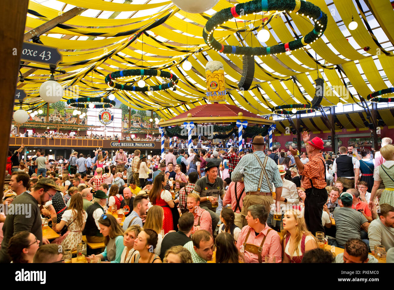 Crowd of people in Paulaner tent in Munich city, Germany Stock Photo