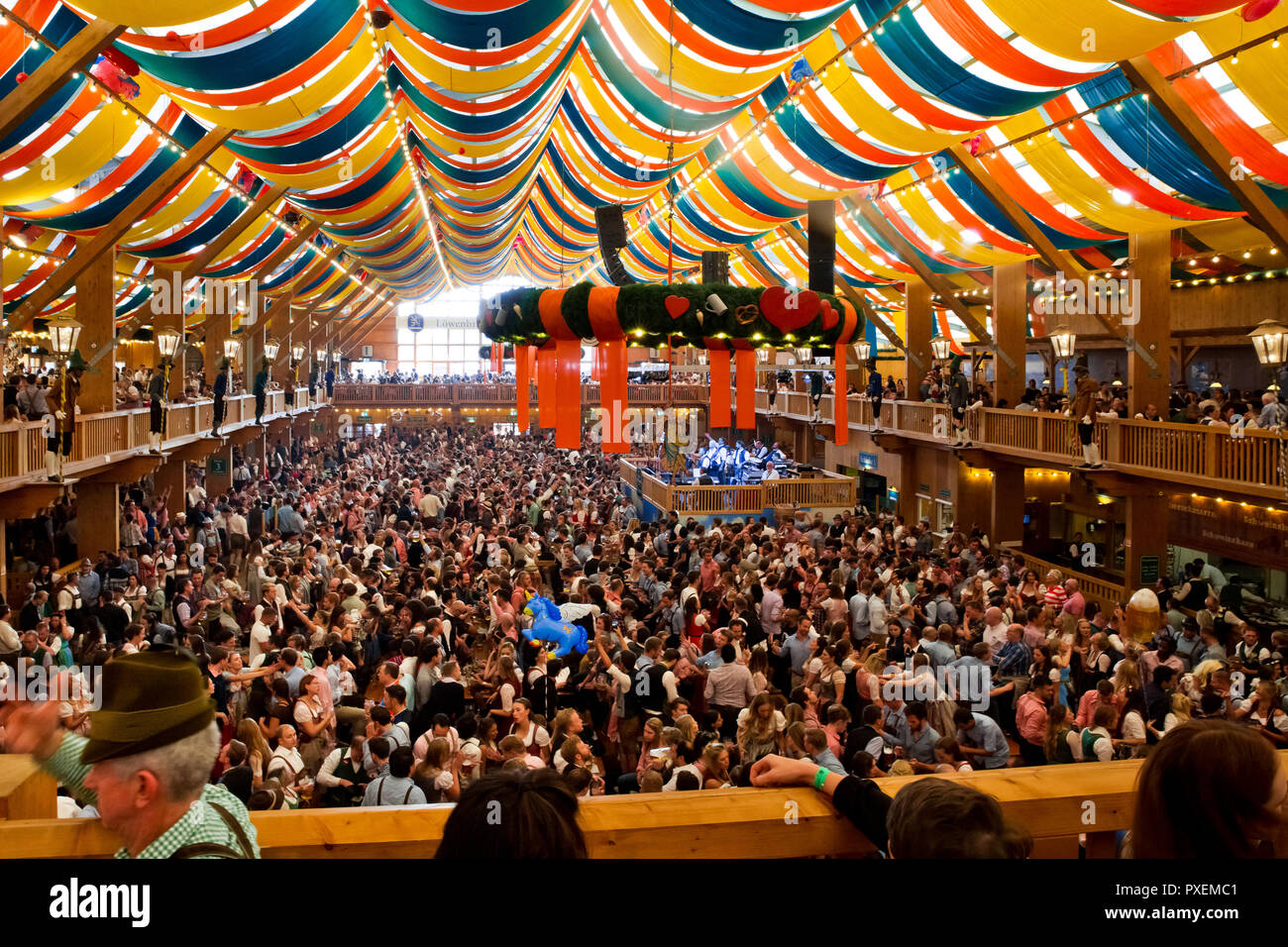 Crowd of people in Lowenbrau tent in Munich city, Germany Stock Photo