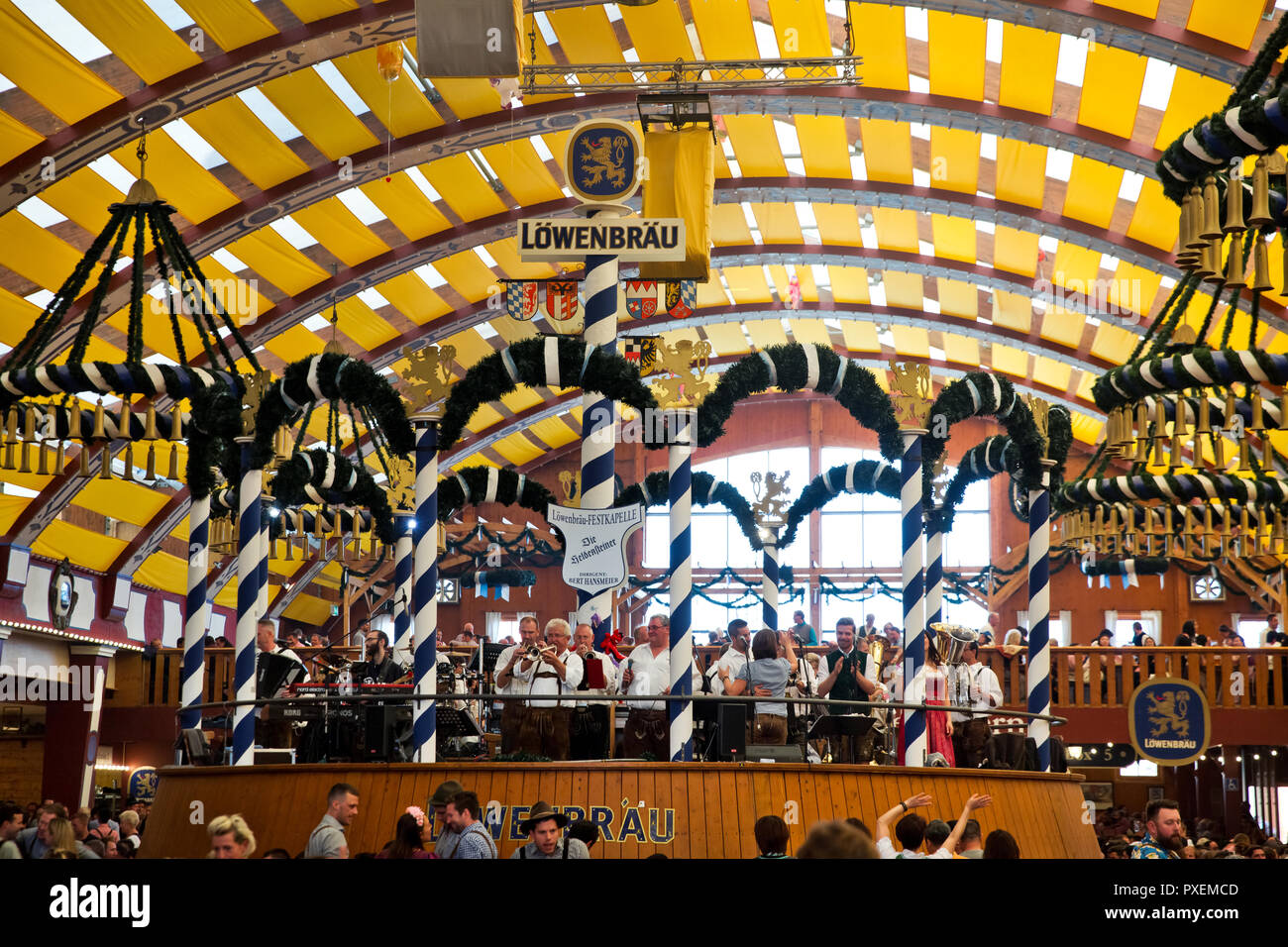 Crowd of people in Lowenbrau tent in Munich city, Germany Stock Photo