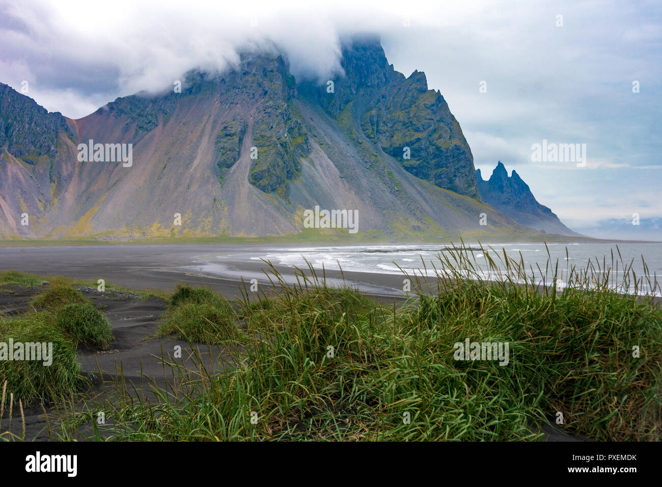 View from Stokksnes lagoon, black sand beach, ocean, and mountains in southeast Iceland Stock Photo