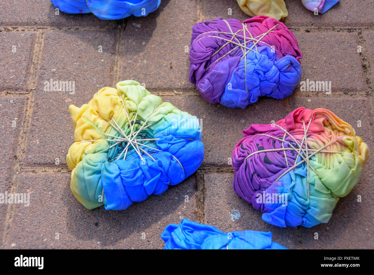 Stillwet tiedye Tshirts compressed with rubber bands after being