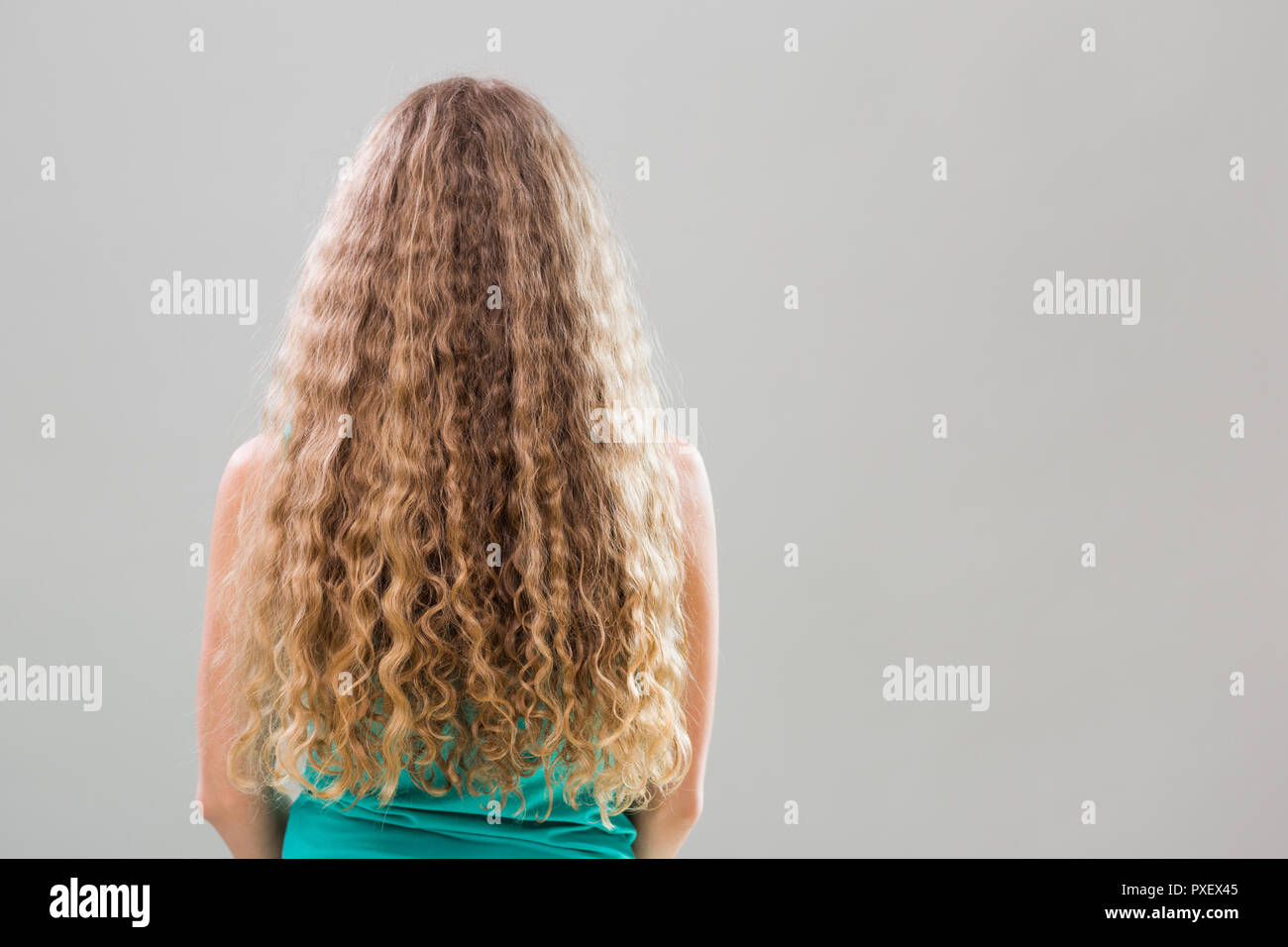 Woman with gorgeous long blonde hair on gray background Stock Photo - Alamy Woman with gorgeous long blonde hair on gray background Stock Photo - Alamy