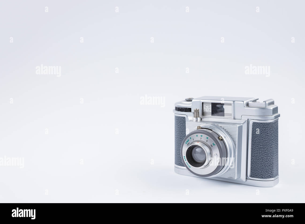 Old, analog film camera on white background Stock Photo