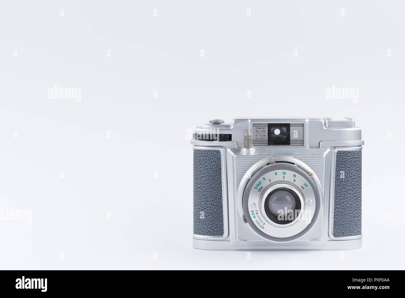 Old, analog film camera on white background Stock Photo