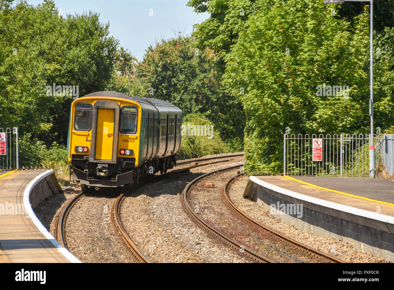 Diesel commuter train leaving Llantwit Major railway station in South