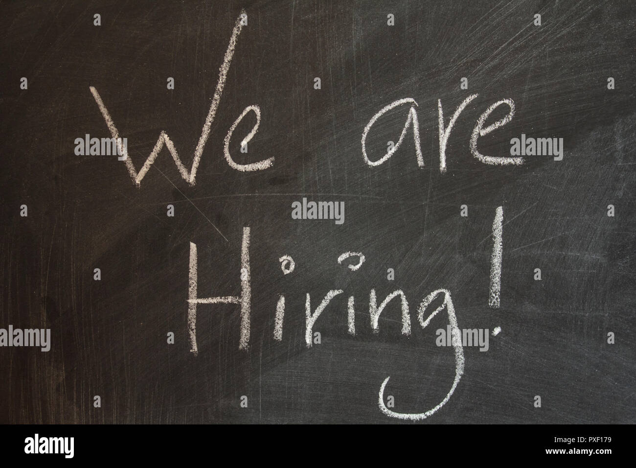 We are hiring written on blackboard Stock Photo