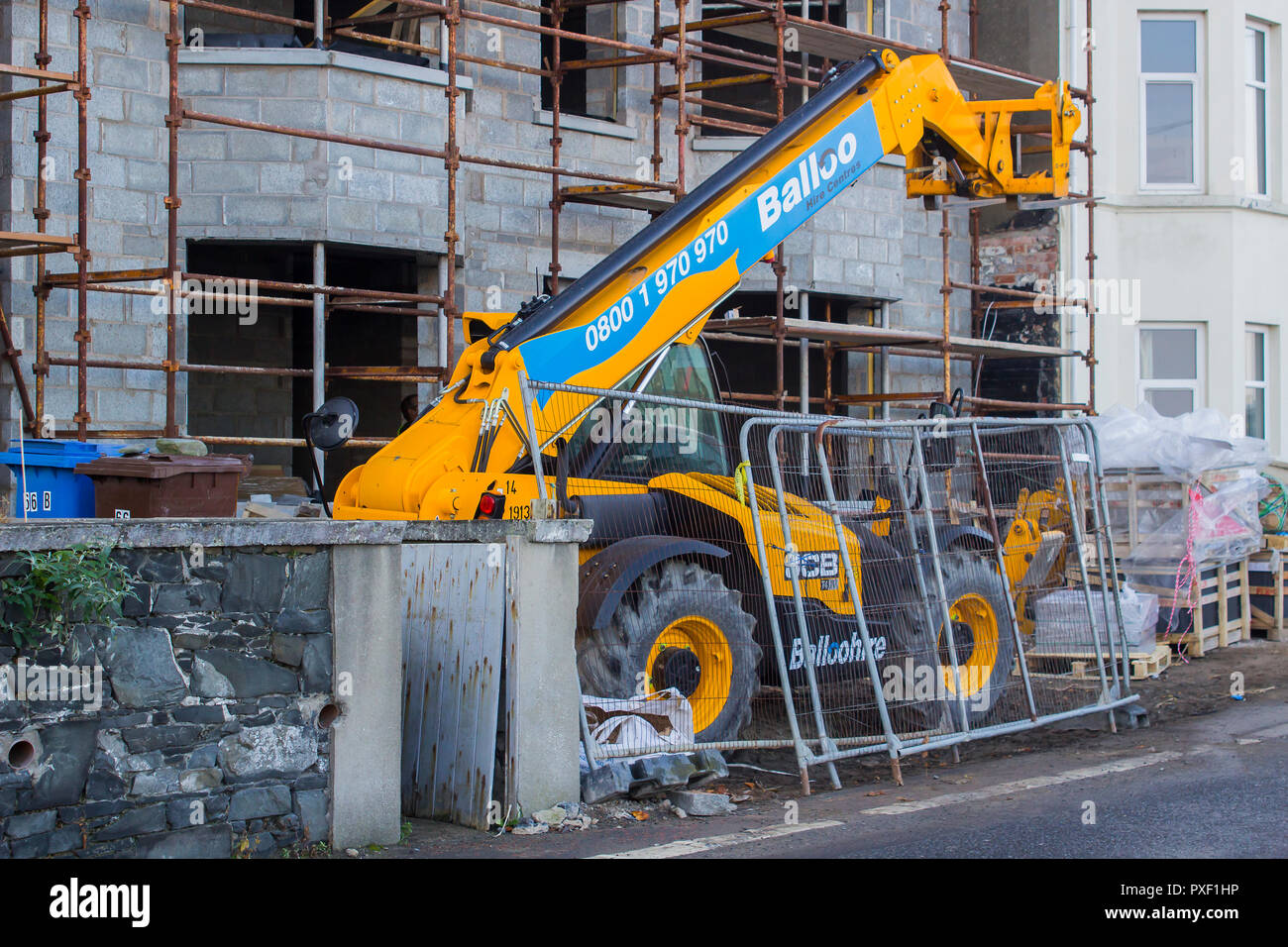 11 October 2018 A large Telescopic Loader used in the construction industry parked up on a small building site on the Seacliff Road in Bangor County D Stock Photo