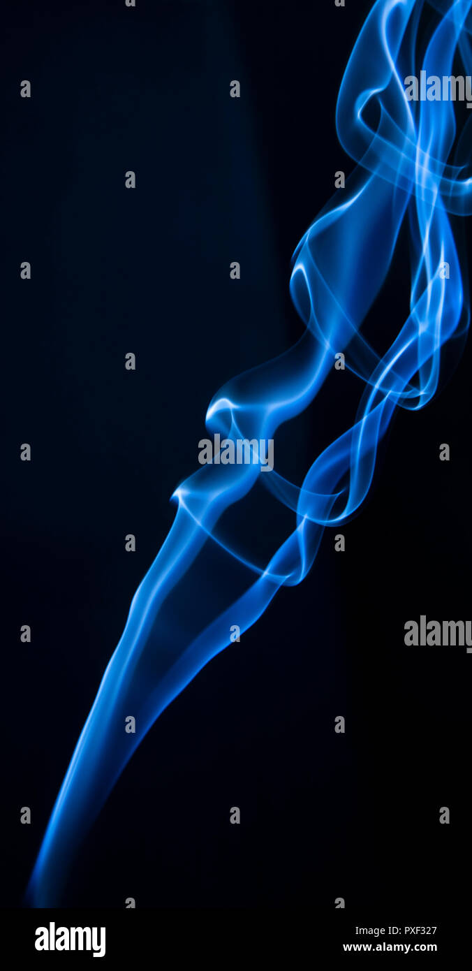 Abstract blue smoke swirls on dark background Stock Photo - Alamy
