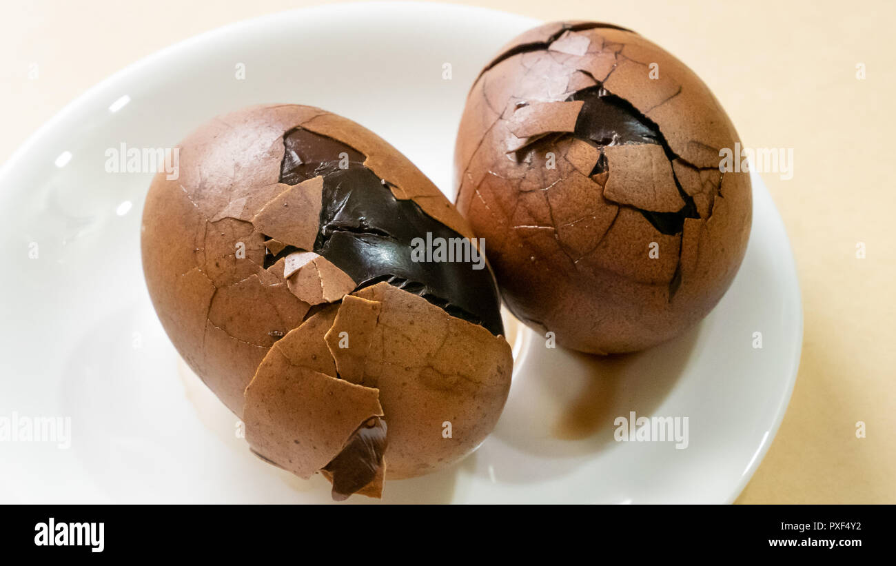 The close up of Taiwan Tea Eggs on mini white plate. Stock Photo