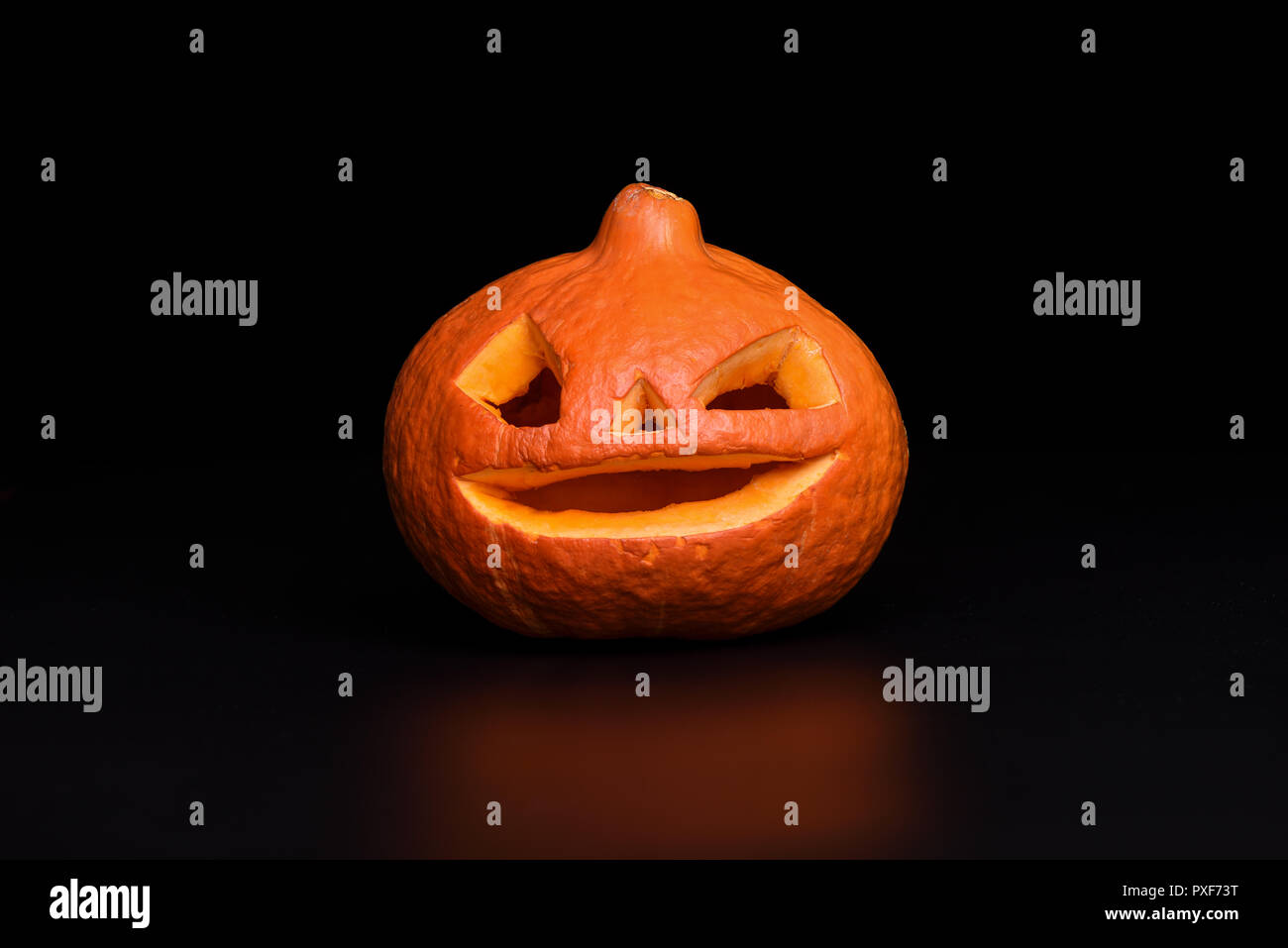 Halloween pumpkin on black background with reflection. Board design ...