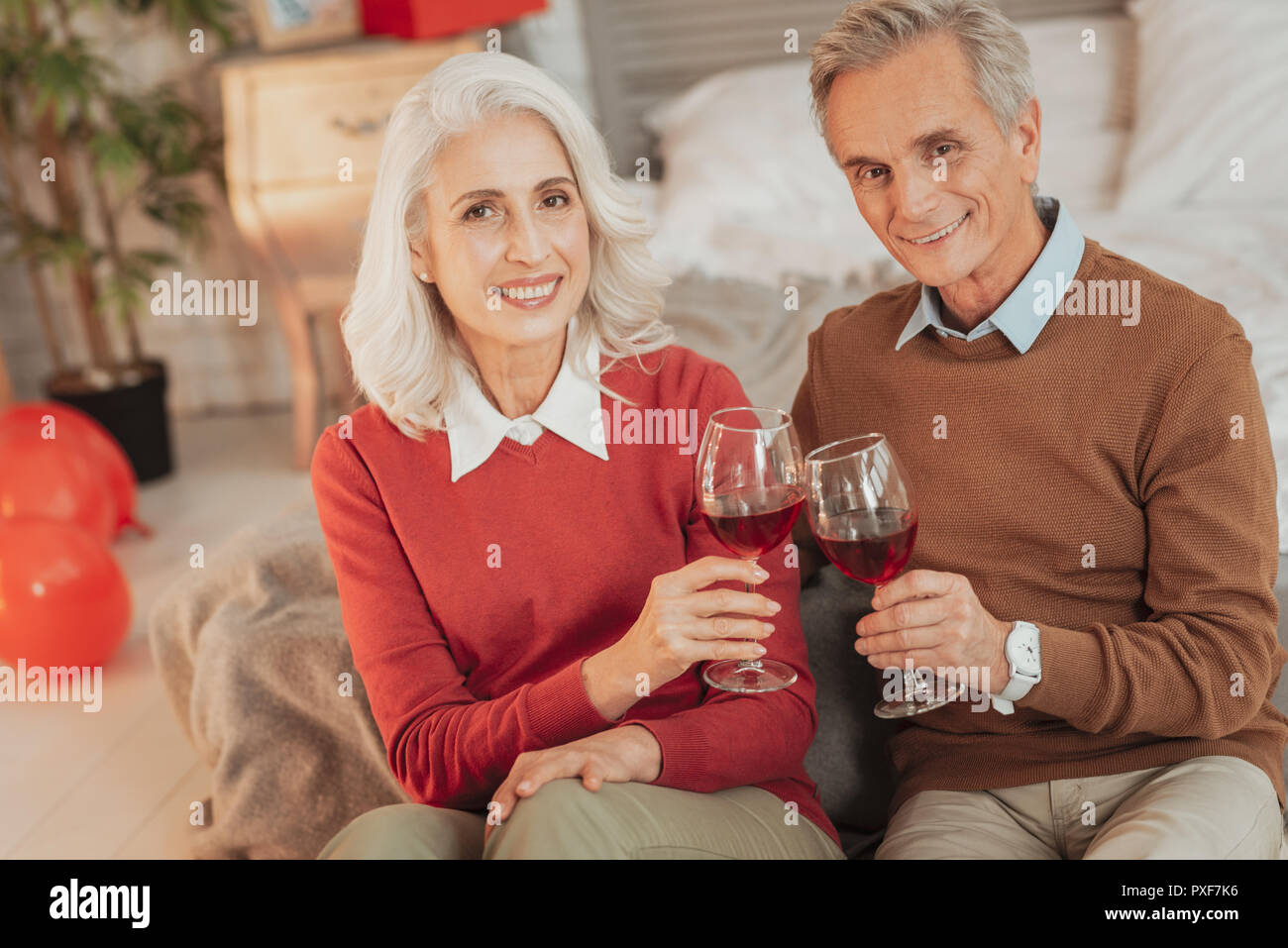 Cheerful senior couple having romantic dinner Stock Photo