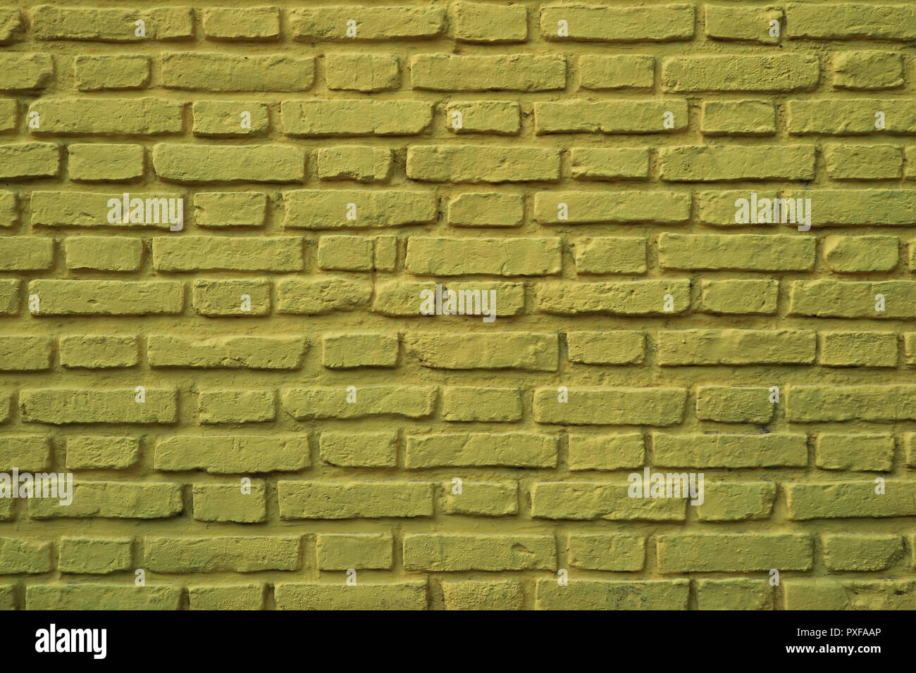 Olive Green Colored Rough Brick Wall at La Boca Neighborhood in Buenos Aires of Argentina, for Background or Banner Stock Photo
