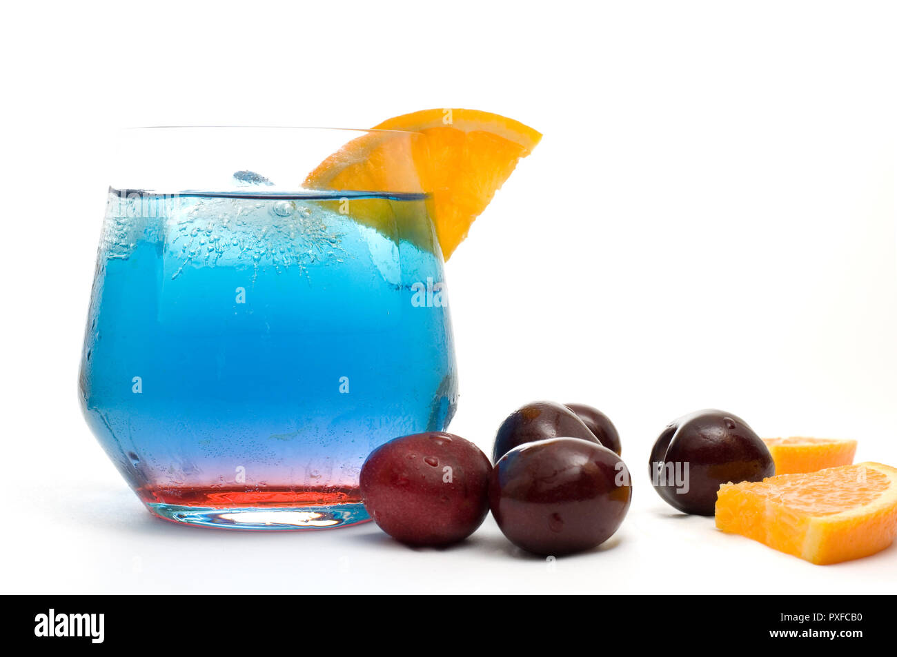 Isolated Fancy Blue Cocktail with Orange Slices and Cherries Horizontal
