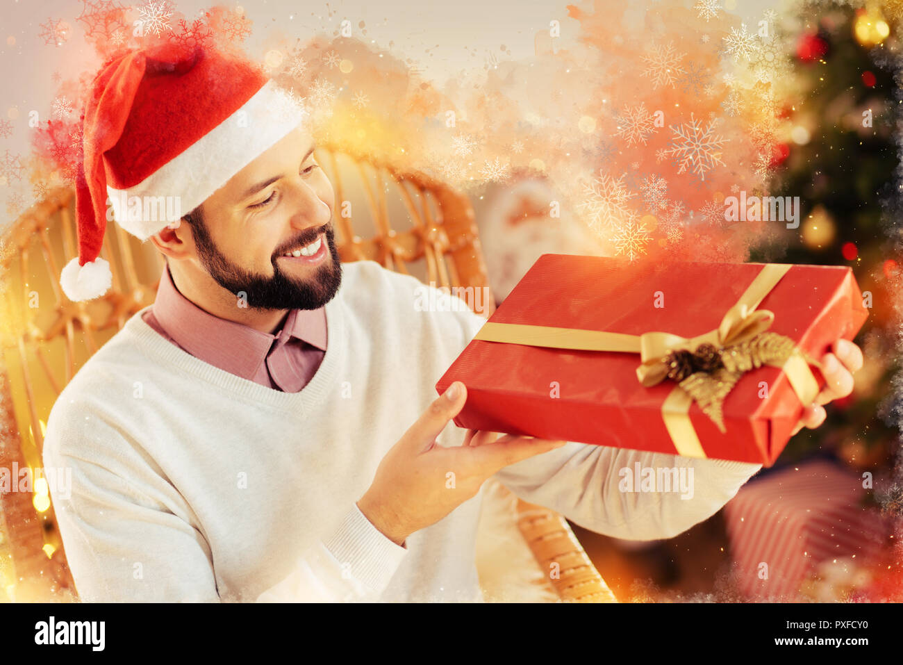 Generous kind-hearted boyfriend holding nice big Christmas gift box for