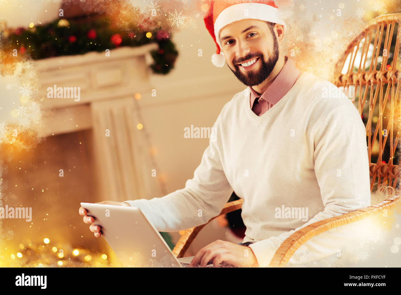 Beaming bearded man feeling extremely happy before Christmas party Stock Photo