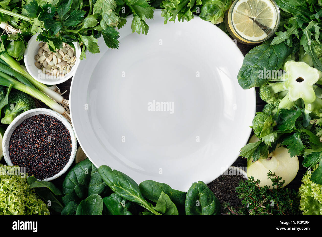 Empty white plate vegetables, fruit, superfood and herbs top view