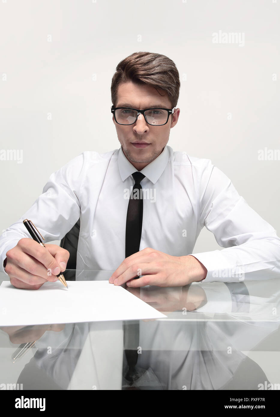 close up.businessman signs a document sitting at the office Desk Stock Photo