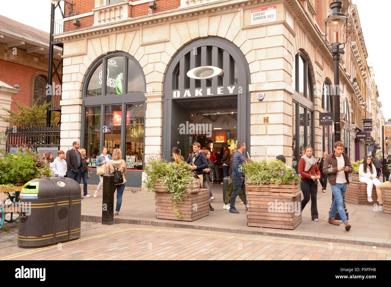 People outside the busy Oakley Sunglasses and clothing shop in Covent Garden,  London, England Stock Photo - Alamy