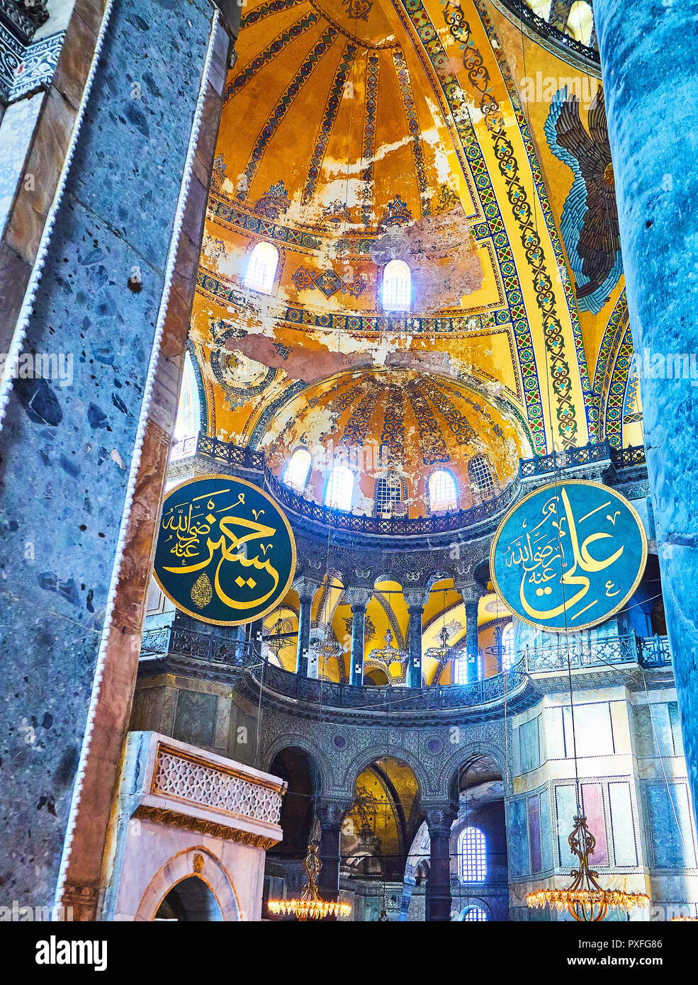 Two of the eight great Calligraphic Panes, hanging from the level of the northwestern Exedra gallery. Istanbul, Turkey. Stock Photo