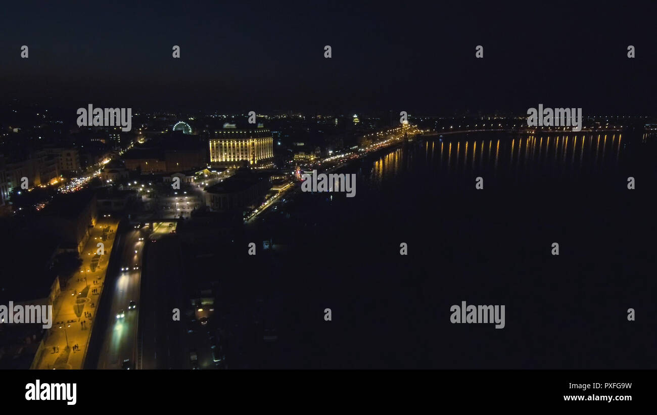 Aerial view from Drone: Top view of the night promenade with bridges ...