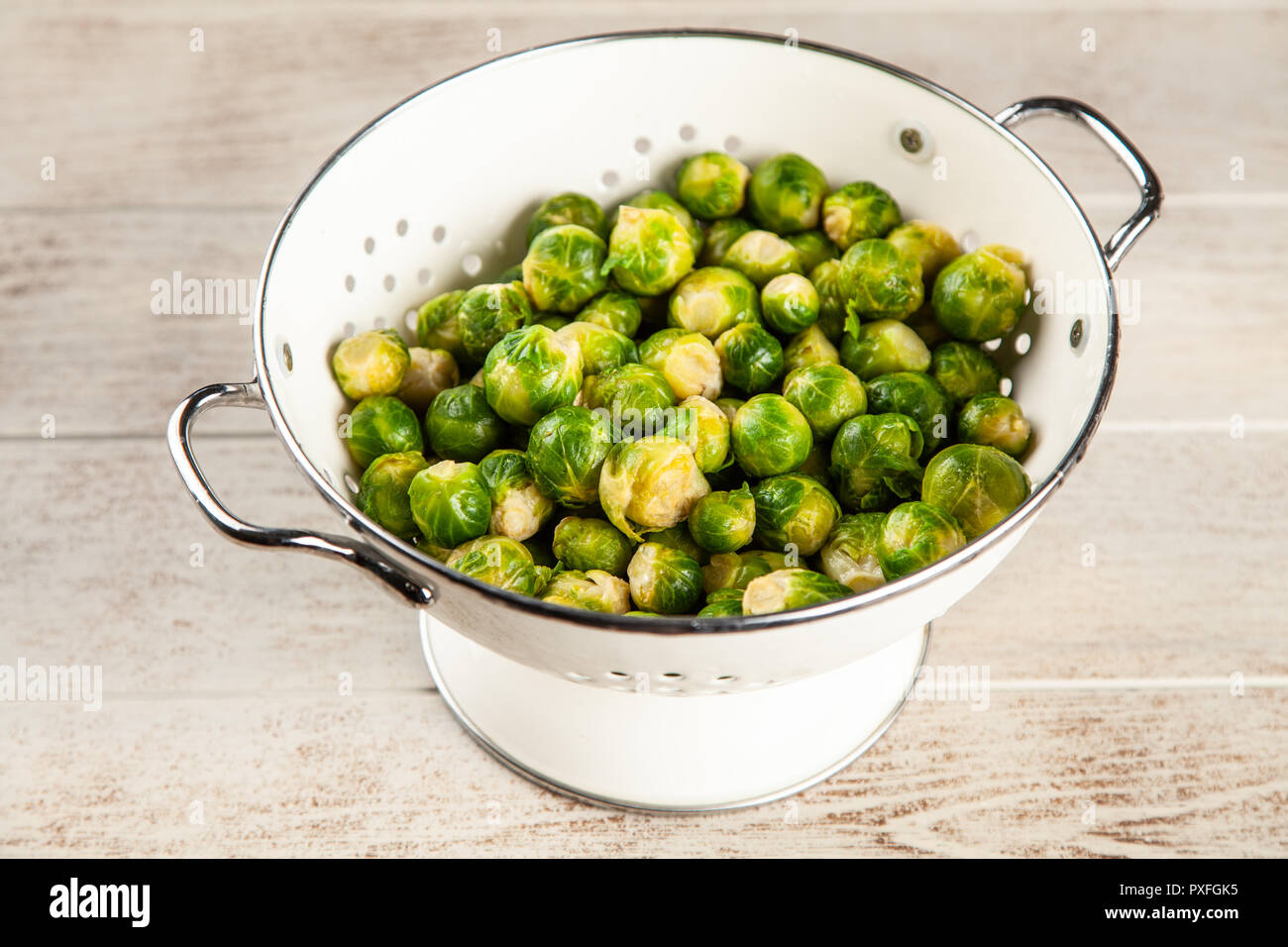 Brussles sprouts in a colander Stock Photo