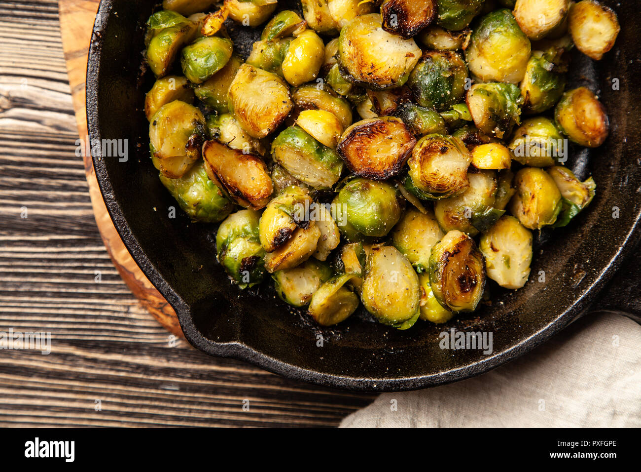 Honey roasted brussles sprouts in a cast iron skillet Stock Photo