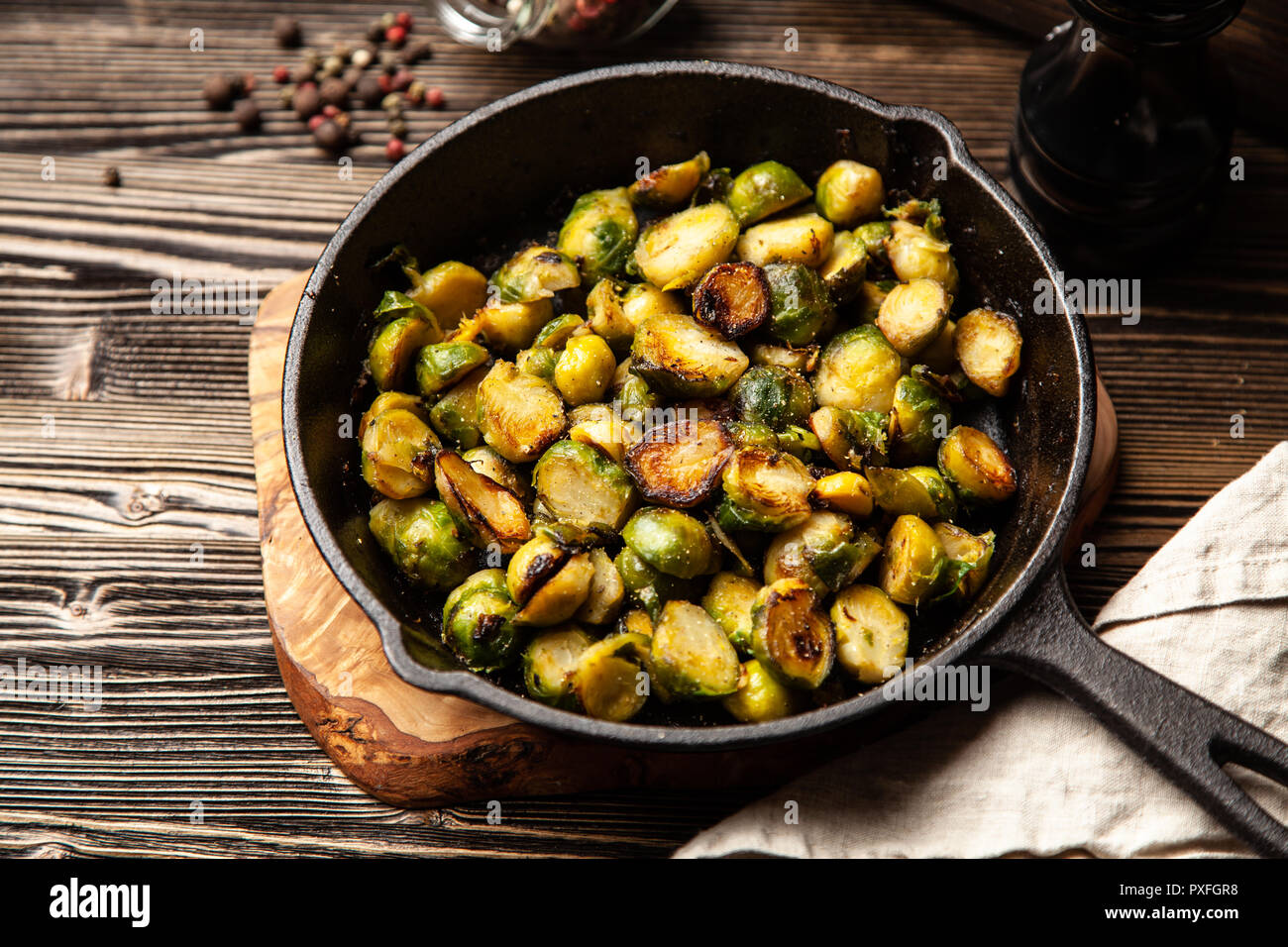 Honey roasted brussles sprouts in a cast iron skillet Stock Photo