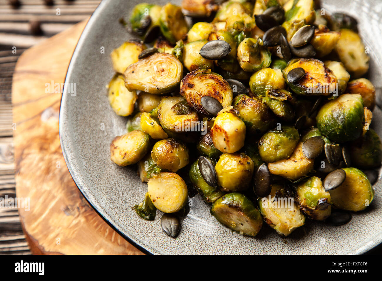 Honey roasted brussles sprouts with pumpkin seeds Stock Photo