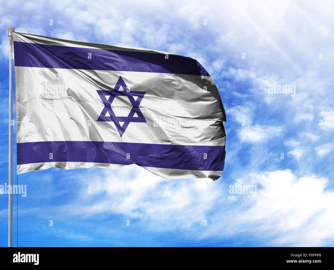 National flag of Israel on a flagpole in front of blue sky Stock Photo ...
