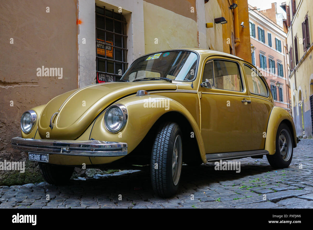 Old Volkswagen Beetle on cobbled street in Rome, Italy Stock Photo