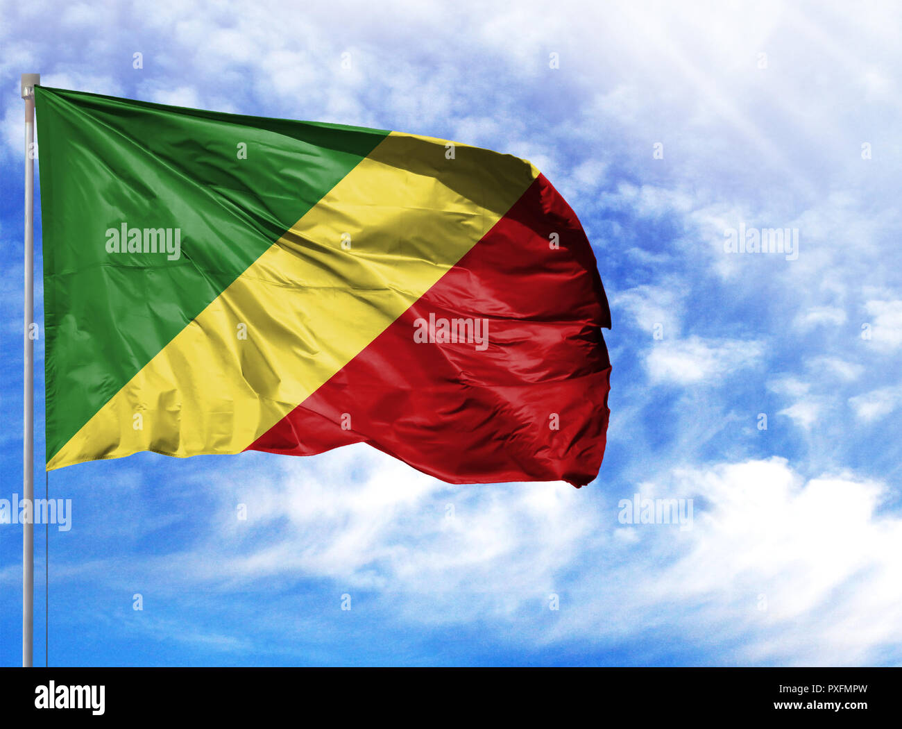 national-flag-of-congo-republic-on-a-flagpole-in-front-of-blue-sky