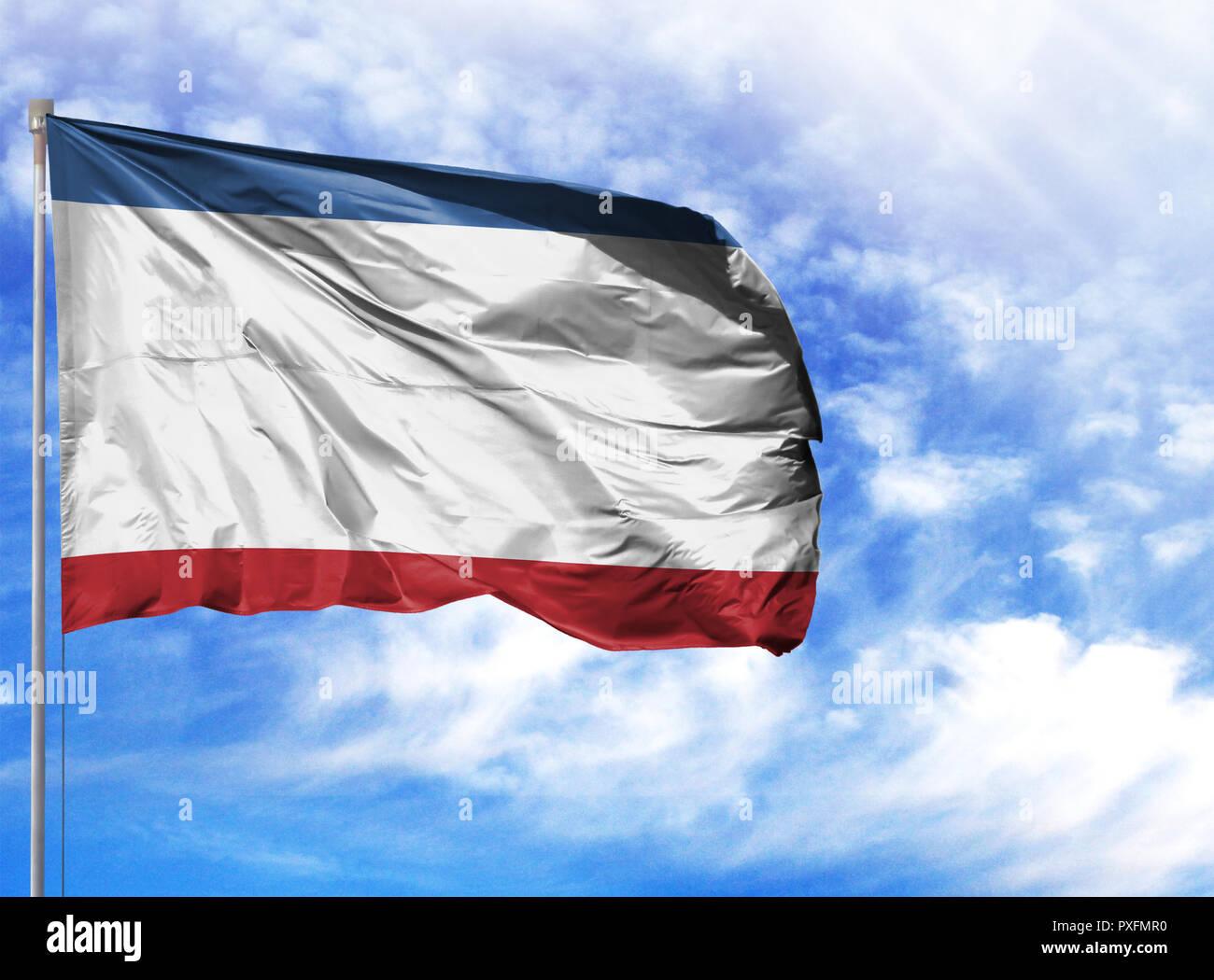 National flag of Crimea on a flagpole in front of blue sky Stock Photo ...