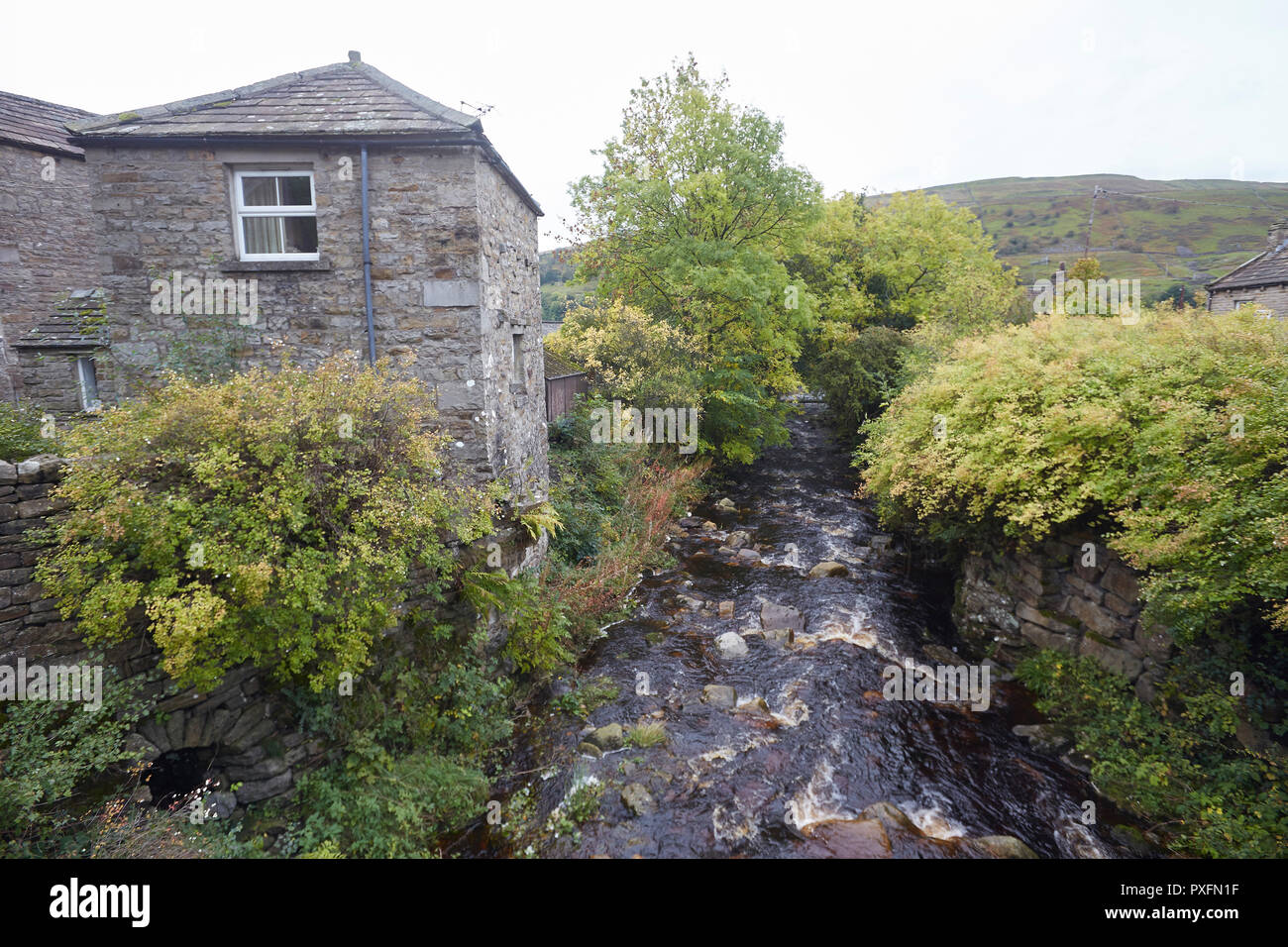 Gunnerside Beck passing through Gunnerside village, Yorkshire Dales National Park, England, UK. Stock Photo