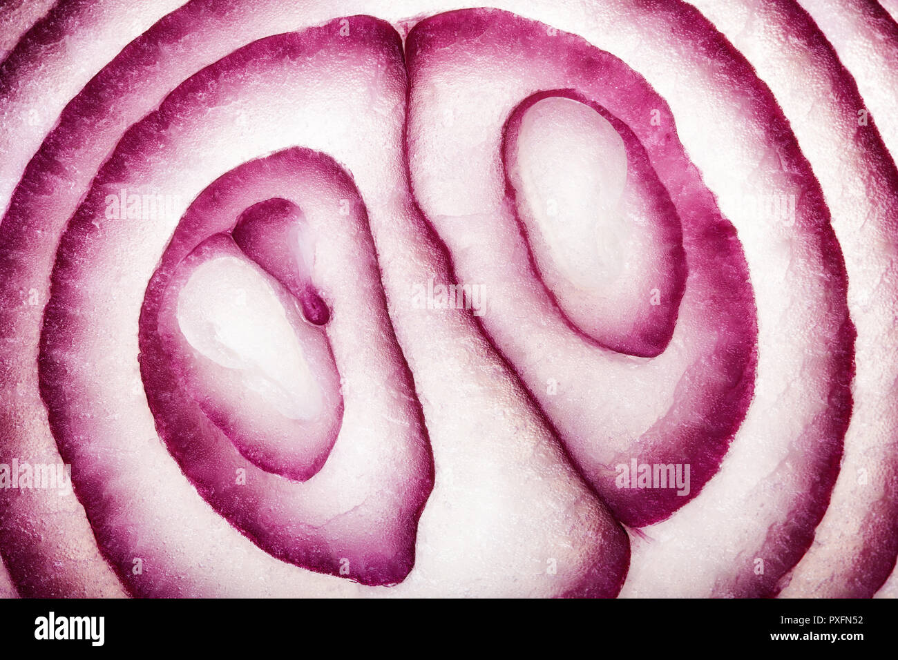 Abstract Food Art Pattern of Red Onion Cross-section photographed close-up and full frame Stock Photo