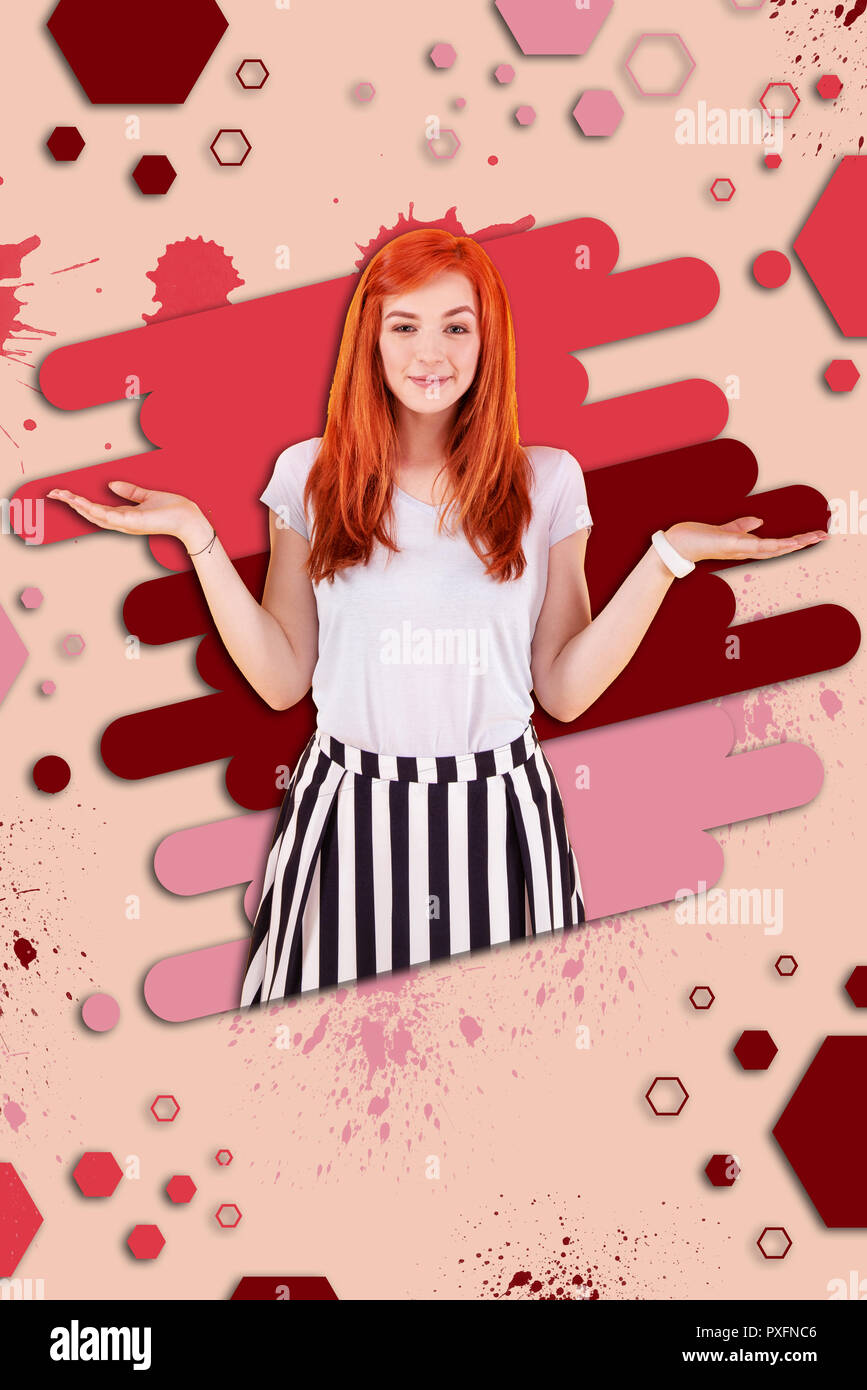 Appealing beaming red-haired girl feeling extremely positive and emotional Stock Photo