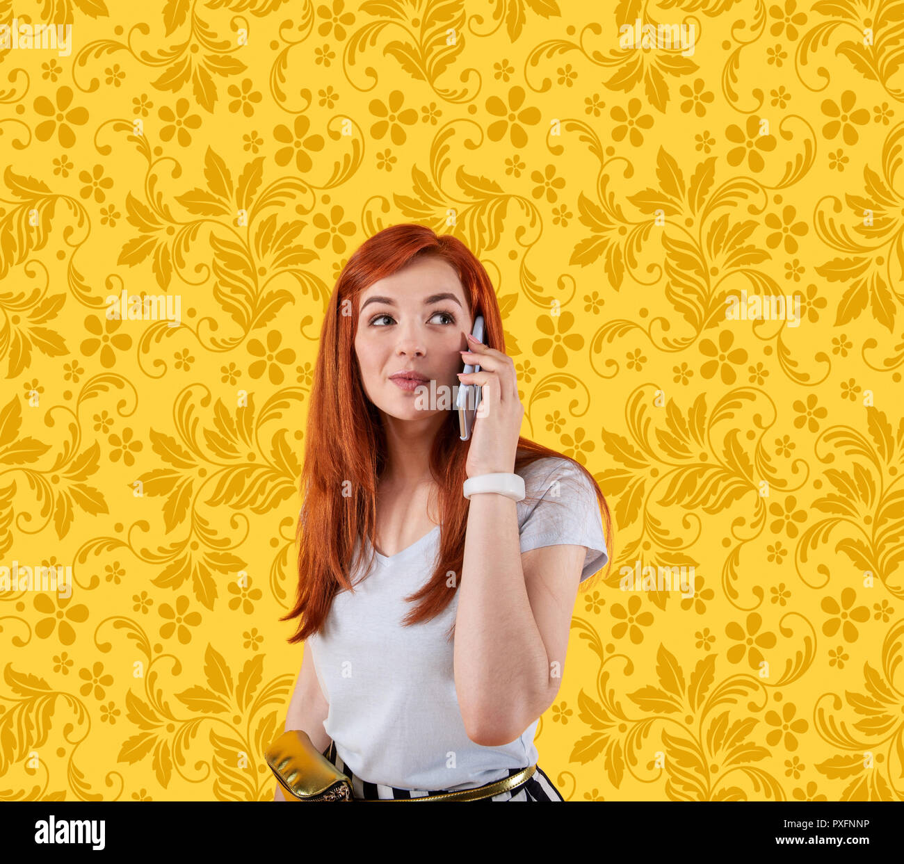Enthusiastic young woman making call Stock Photo