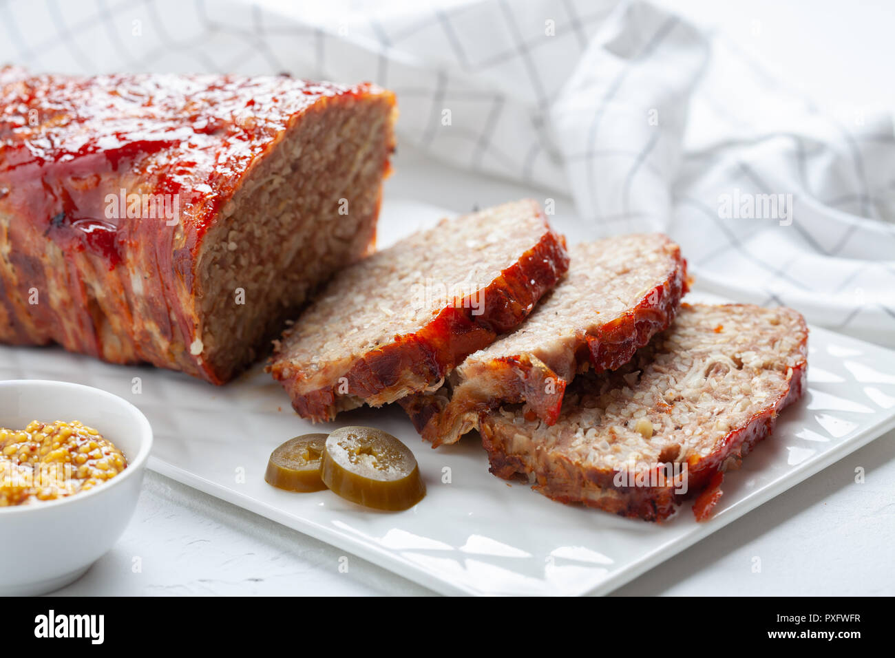 Bacon Wrapped Ground Beef Meatloaf with Cabbage and Bulgur Stock Photo
