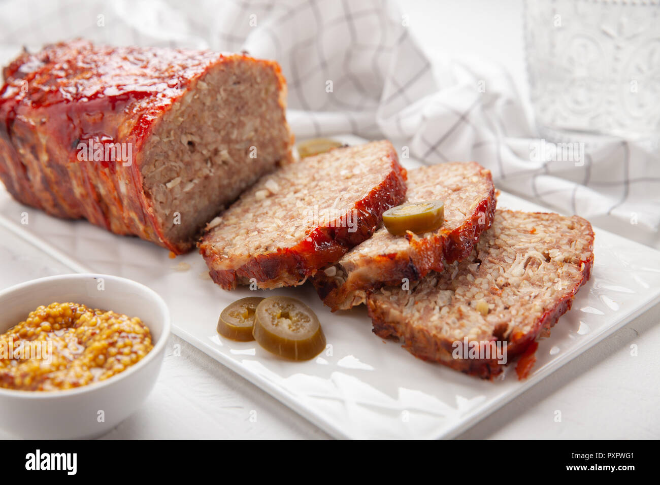Bacon Wrapped Ground Beef Meatloaf with Cabbage and Bulgur Stock Photo